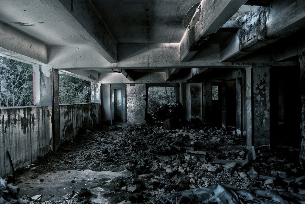 A room filled with rubble and debris in the middle of it.