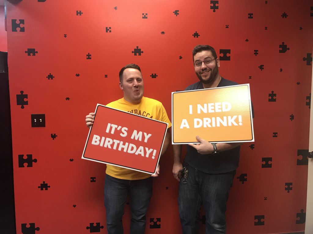 Two men holding signs that say " it's my birthday ".