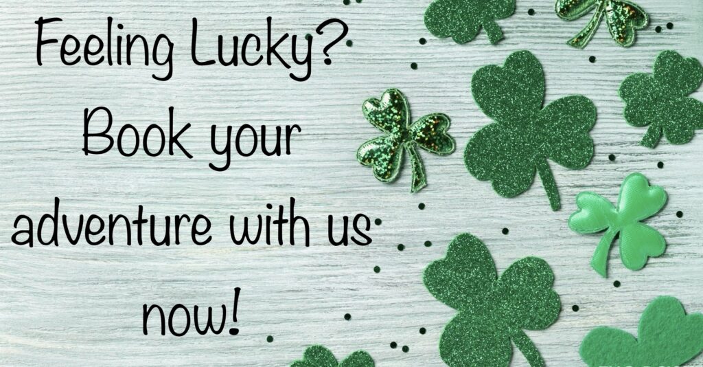 A wooden table with green shamrocks and the words " lucky ?"