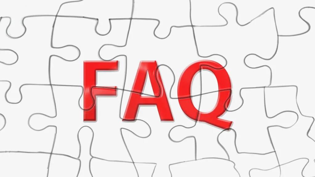 Red FAQ letters on a white jigsaw puzzle background.